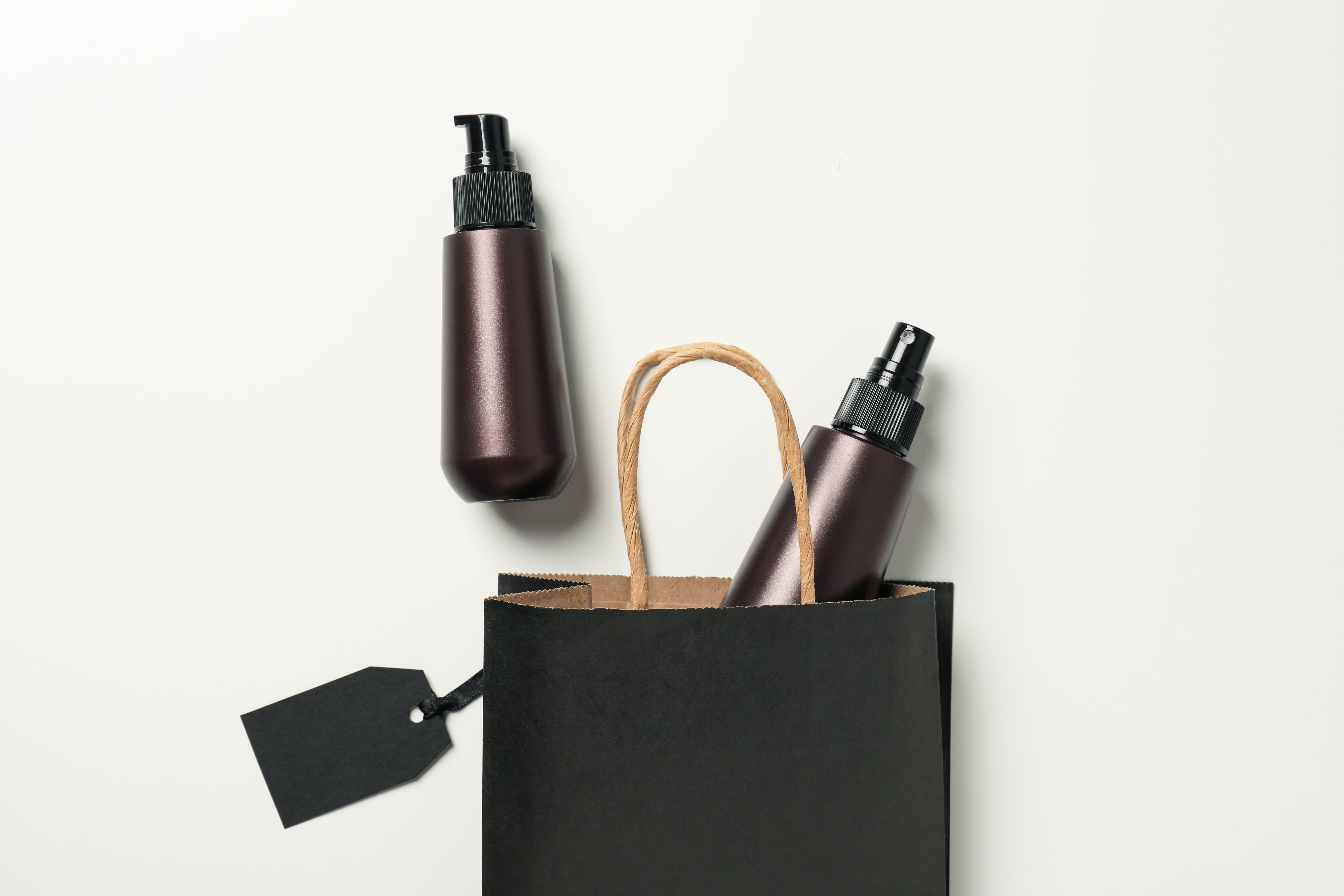 Spray With Minimalist Packaging Coming Out Of A Shopping Bag