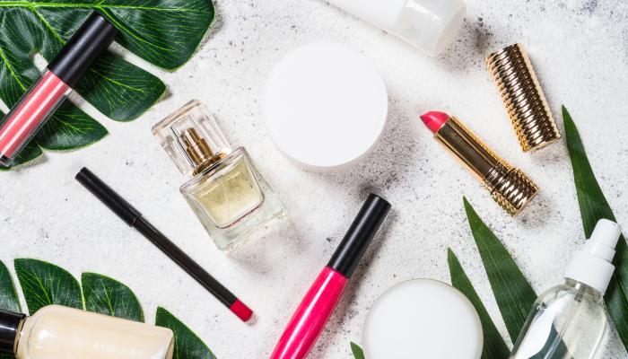 Cosmetic Products Laid Out with Green Leafs