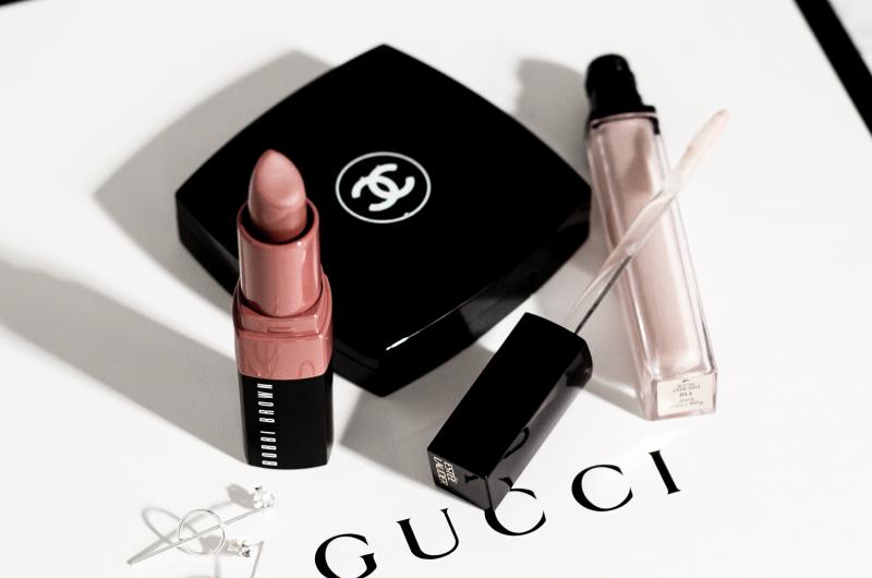Gucci lipstick and lip gloss on top of packaging