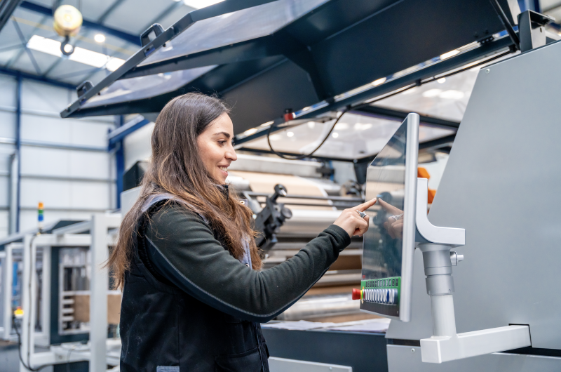 Female Warehouse Worker Using Technology
